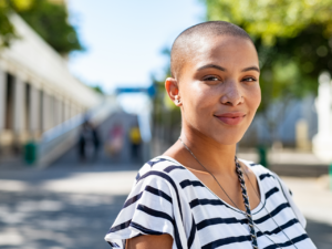 Bald girl is happy because she got rid of lice